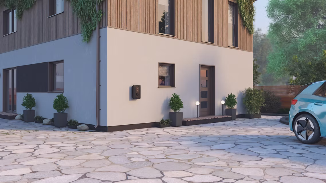 Smart home EV charger installed on an exterior wall